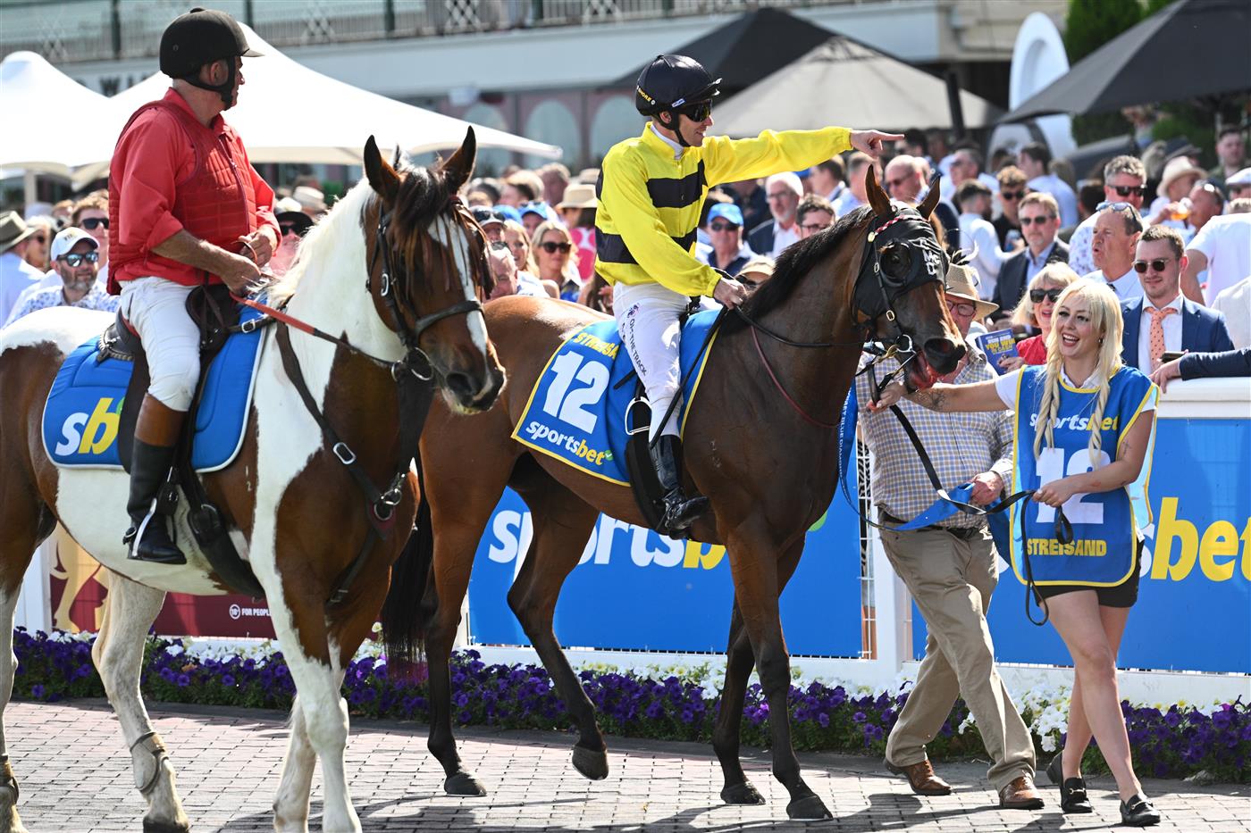 MELBOURNE, AUSTRALIA - FEBRUARY 21: Ben Melham riding Streisand after winning in Race 8, the Sportsbet Blue Diamond Stakes during Melbourne Racing at Caulfield Racecourse on February 21, 2026 in Melbourne, Australia. (Photo by Vince Caligiuri/Getty Images)