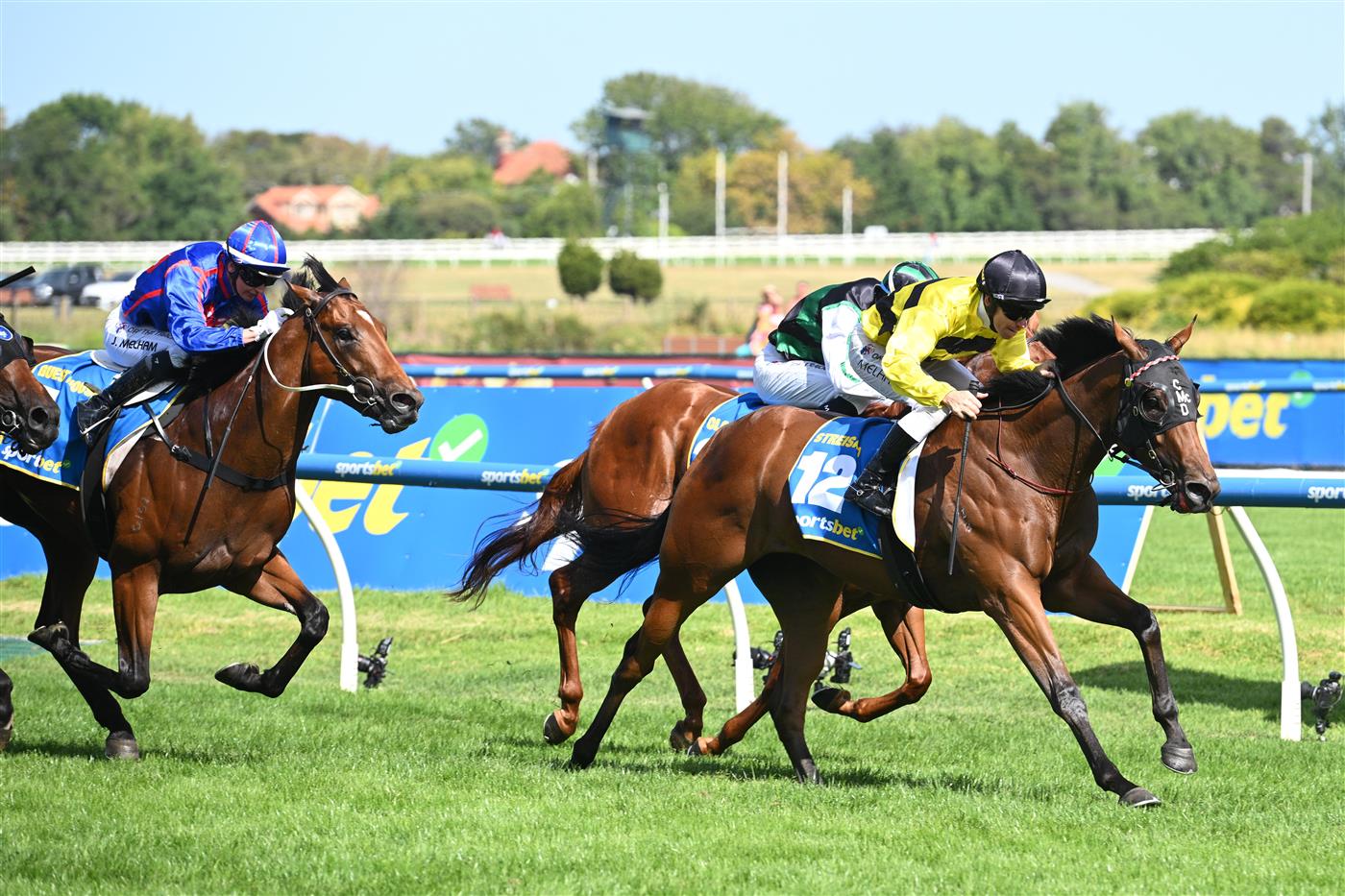 MELBOURNE, AUSTRALIA - FEBRUARY 21: Ben Melham riding Streisand defeats Closer To Free and Guest House in Race 8, the Sportsbet Blue Diamond Stakes during Melbourne Racing at Caulfield Racecourse on February 21, 2026 in Melbourne, Australia. (Photo by Vince Caligiuri/Getty Images)