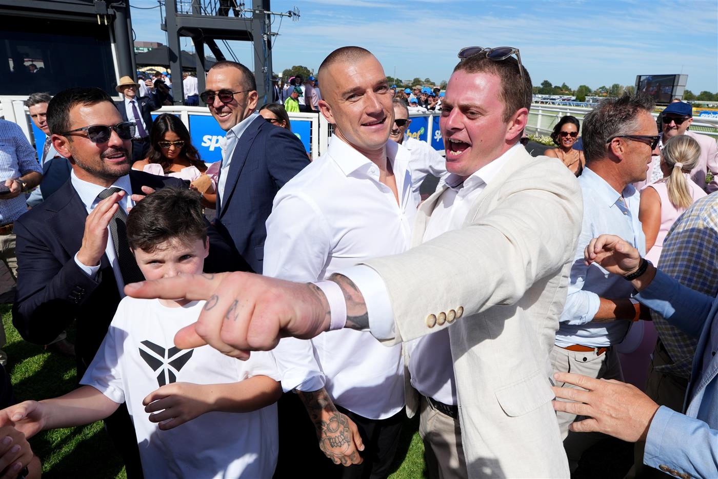 MELBOURNE, AUSTRALIA - FEBRUARY 21: Winning connections  including ex Richmond champion, Dustin Martin (L) celebrates after Streisand won Race 8, the Sportsbet Blue Diamond Stakes during Melbourne Racing at Caulfield Racecourse on February 21, 2026 in Melbourne, Australia. (Photo by Vince Caligiuri/Getty Images)