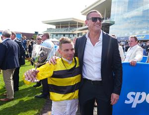 MELBOURNE, AUSTRALIA - FEBRUARY 21: Ben Melham poses with part owner Michael Gardiner after riding Streisand to win in Race 8, the Sportsbet Blue Diamond Stakes during Melbourne Racing at Caulfield Racecourse on February 21, 2026 in Melbourne, Australia. (Photo by Vince Caligiuri/Getty Images)