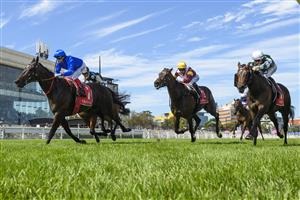MELBOURNE, AUSTRALIA - FEBRUARY 21: Craig Williams riding Pericles defeats Buckaroo, Damian Lane riding riding Treasurethe Moment and Evaporate in Race 7, the Henley Homes Futurity Stakes during Melbourne Racing at Caulfield Racecourse on February 21, 2026 in Melbourne, Australia. (Photo by Vince Caligiuri/Getty Images)