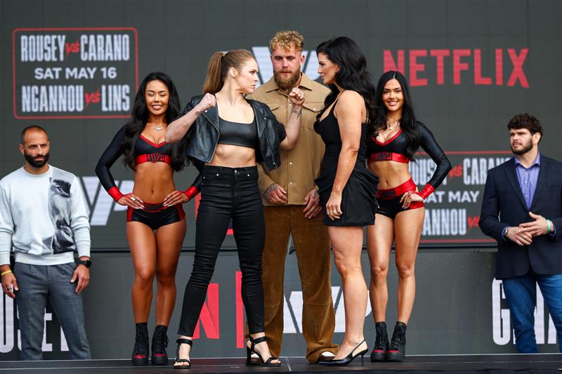 Ronda Rousey and Gina Carano face off during Netflix's Ronda Rousey x Gina Carano Los Angeles MMA Press Conference at Intuit Dome on March 10, 2026 in Inglewood, California. (Getty Images for Netflix)