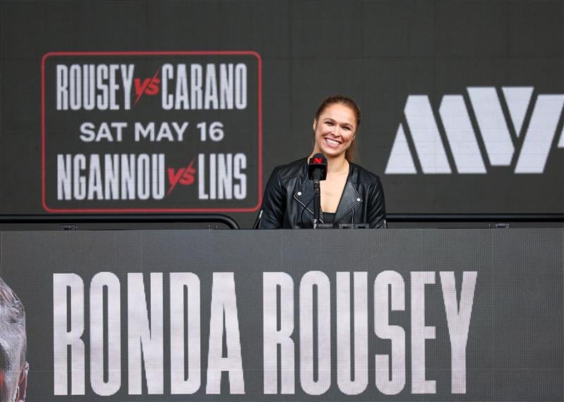 Ronda Rousey speaks onstage during Netflix's Ronda Rousey x Gina Carano Los Angeles MMA Press Conference at Intuit Dome on March 10, 2026 in Inglewood, California. (Getty Images for Netflix)
