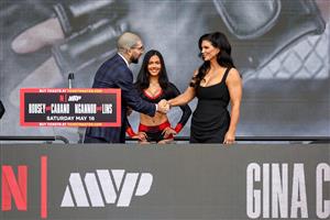 Ariel Helwani and Gina Carano attend Netflix's Ronda Rousey x Gina Carano Los Angeles MMA Press Conference at Intuit Dome on March 10, 2026 in Inglewood, California. (Getty Images for Netflix)