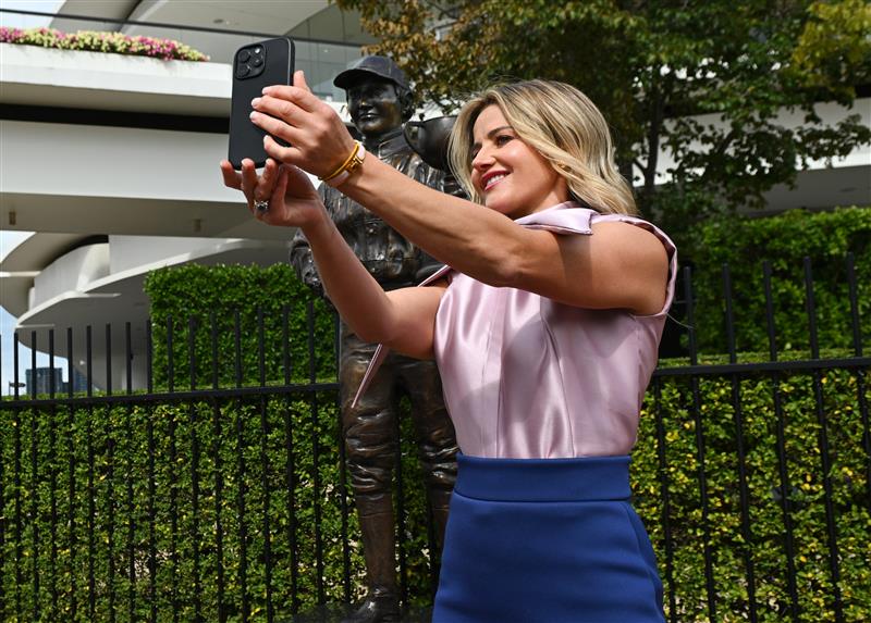 MELBOURNE, AUSTRALIA - MARCH 26: Michelle Payne, the first female jockey to win Australia’s most iconic race, the Lexus Melbourne Cup aboard Prince of Penzance takes a selfie during the official unveiling of the Michelle Payne Statue at Flemington Racecourse on March 26, 2026 in Melbourne, Australia. (Photo by Vince Caligiuri/Getty Images)