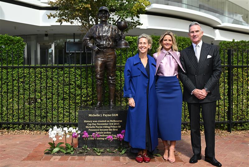 MELBOURNE, AUSTRALIA - MARCH 26: Michelle Payne, the first female jockey to win Australia’s most iconic race, the Lexus Melbourne Cup aboard Prince of Penzance poses with Kylie Rogers – VRC CEO and Neil Wilson – VRC Chairman during the official unveiling of the Michelle Payne Statue at Flemington Racecourse on March 26, 2026 in Melbourne, Australia. (Photo by Vince Caligiuri/Getty Images)