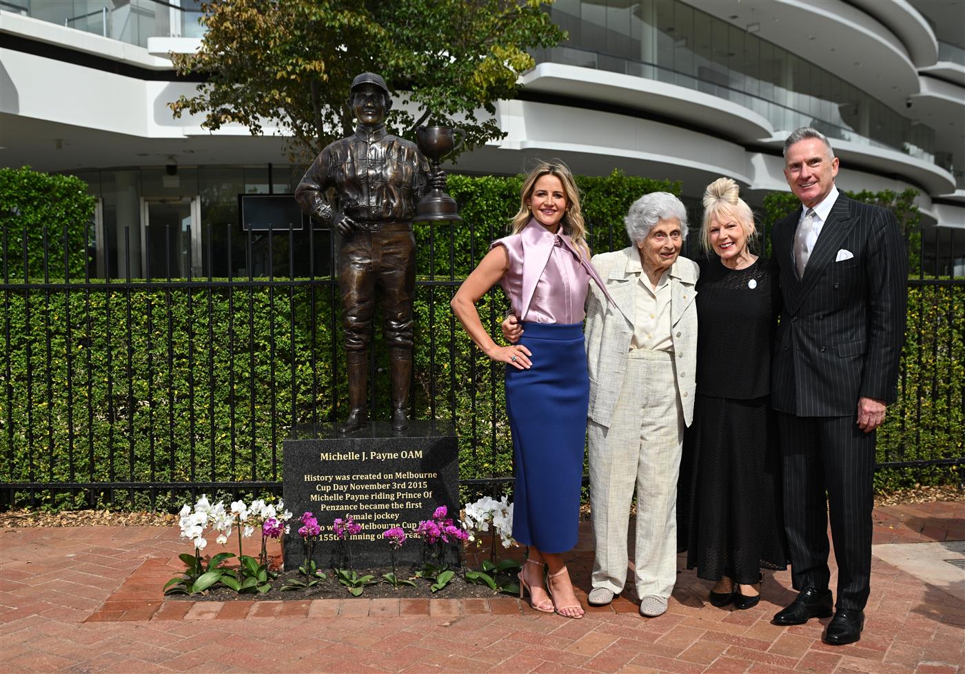 MELBOURNE, AUSTRALIA - MARCH 26: Michelle Payne, the first female jockey to win Australia’s most iconic race, the Lexus Melbourne Cup aboard Prince of Penzance poses with  philanthropist Lady Marigold Southey AC, acclaimed artist Judith Leman and and Neil Wilson – VRC Chairman (r) during the official unveiling of the Michelle Payne Statue at Flemington Racecourse on March 26, 2026 in Melbourne, Australia. (Photo by Vince Caligiuri/Getty Images)