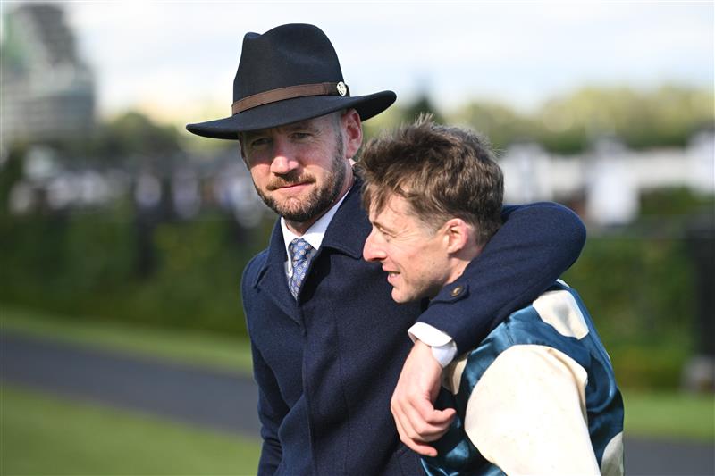MELBOURNE, AUSTRALIA - MARCH 28: Harry Coffey and trainer Ciaron Maher after Light Infantry Man won Race 8, the Tab Australian Cup during Melbourne Racing at Flemington Racecourse on March 28, 2026 in Melbourne, Australia. (Photo by Vince Caligiuri/Getty Images)