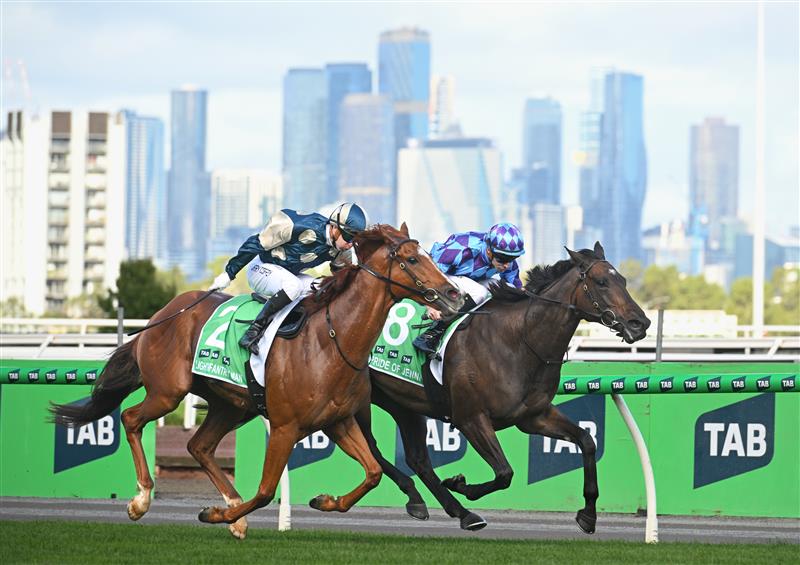 MELBOURNE, AUSTRALIA - MARCH 28: Harry Coffey riding Light Infantry Man defeats Declan Bates riding Pride of Jenni in Race 8, the Tab Australian Cup during Melbourne Racing at Flemington Racecourse on March 28, 2026 in Melbourne, Australia. (Photo by Vince Caligiuri/Getty Images)