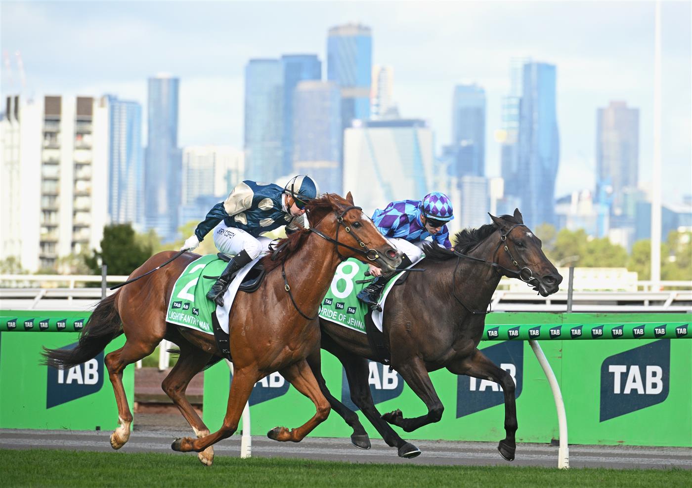 MELBOURNE, AUSTRALIA - MARCH 28: Harry Coffey riding Light Infantry Man defeats Declan Bates riding Pride of Jenni in Race 8, the Tab Australian Cup during Melbourne Racing at Flemington Racecourse on March 28, 2026 in Melbourne, Australia. (Photo by Vince Caligiuri/Getty Images)