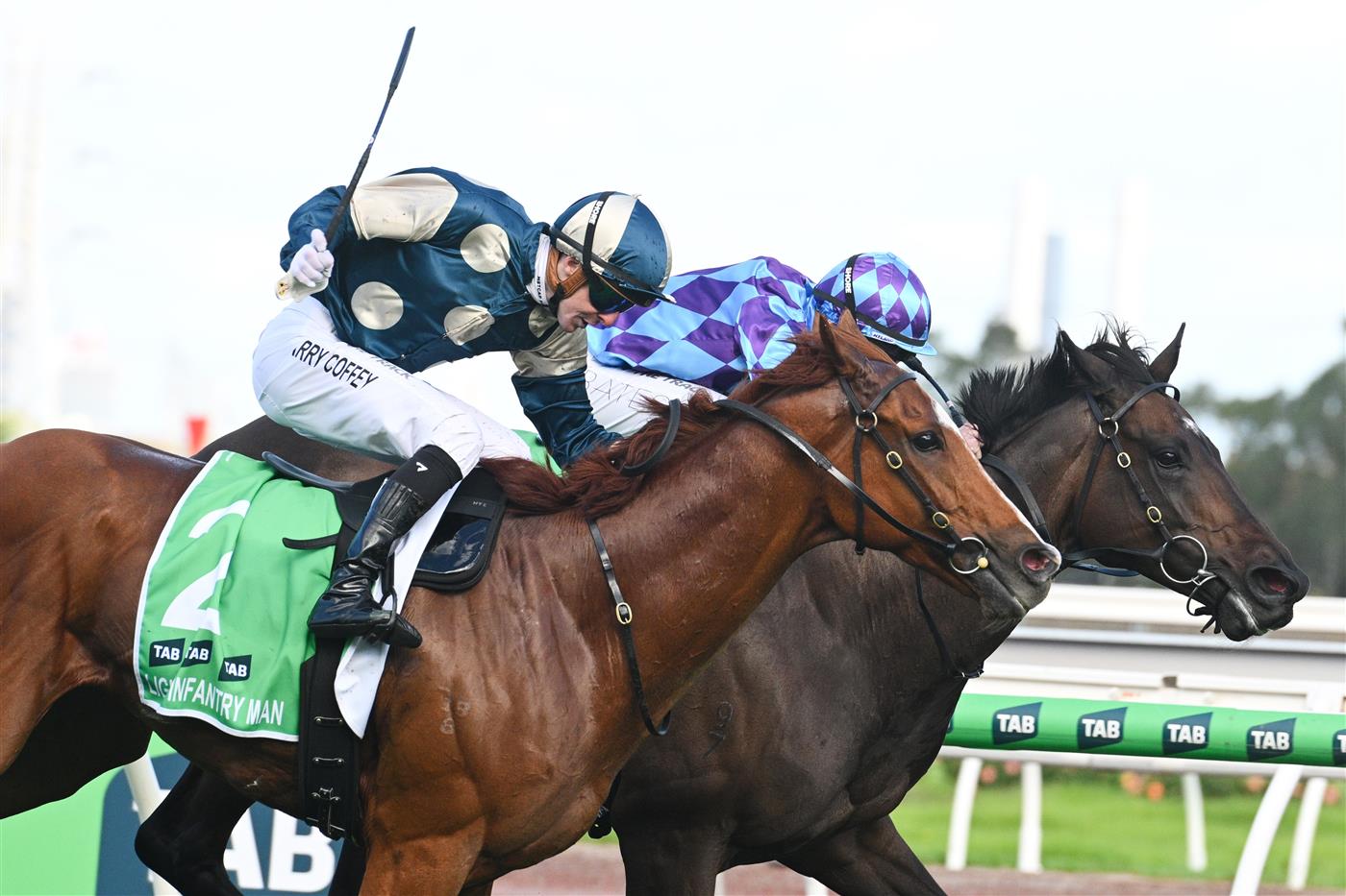 MELBOURNE, AUSTRALIA - MARCH 28: Harry Coffey riding Light Infantry Man defeats Declan Bates riding Pride of Jenni in Race 8, the Tab Australian Cup during Melbourne Racing at Flemington Racecourse on March 28, 2026 in Melbourne, Australia. (Photo by Vince Caligiuri/Getty Images)