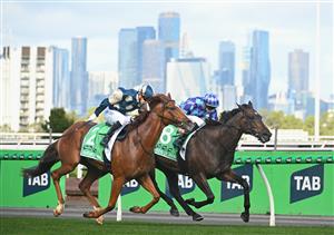 MELBOURNE, AUSTRALIA - MARCH 28: Harry Coffey riding Light Infantry Man defeats Declan Bates riding Pride of Jenni in Race 8, the Tab Australian Cup during Melbourne Racing at Flemington Racecourse on March 28, 2026 in Melbourne, Australia. (Photo by Vince Caligiuri/Getty Images)