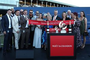 SYDNEY, AUSTRALIA - APRIL 11: Matthew Smith trainer of Idle Flyer ridden by Zac Lloyd celebrates with connections after winning Race 8 The Moet & Chandon Queen of the Turf Stakes during Sydney Racing at Royal Randwick Racecourse on April 11, 2026 in Sydney, Australia. (Photo by Jason McCawley/Getty Images)