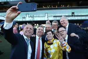 SYDNEY, AUSTRALIA - APRIL 11: Craig Williams riding Sir Delius takes a selfie with connections after winning Race 9 The Queen Elizabeth Stakes during Sydney Racing at Royal Randwick Racecourse on April 11, 2026 in Sydney, Australia. (Photo by Jason McCawley/Getty Images)
