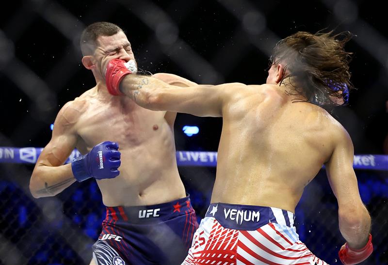 Diego Lopes of Brazil (R) lands a punch on Steve Garcia of the United States during UFC Freedom 250 at the White House on June 14, 2026 in Washington, DC. (Photo by Chris Graythen/Getty Images)