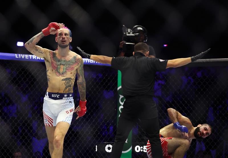 Sean O'Malley of the Untied States salutes US service members in attendance after defeating Aiemann Zahabi of Canada by technical knockout in their bantamweight bout during UFC Freedom 250 at the White House on June 14, 2026 in Washington, DC. (Photo by Chris Graythen/Getty Images)