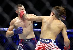 Diego Lopes of Brazil (R) lands a punch on Steve Garcia of the United States during UFC Freedom 250 at the White House on June 14, 2026 in Washington, DC. (Photo by Chris Graythen/Getty Images)