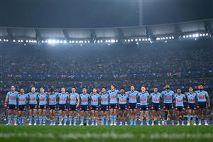 The New South Wales Blues line up for the national anthem ahead of Game 2 of the 2026 State of Origin series between the New South Wales Blues and Queensland Maroons at the Melbourne Cricket Ground on June 17, 2026 in Melbourne, Australia. (Getty)