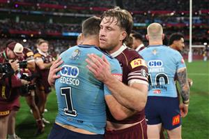James Tedesco of the New South Wales Blues and Cameron Munster of the Queensland Maroons embrace at full-time following Game 2 of the 2026 State of Origin series at the Melbourne Cricket Ground on June 17, 2026 in Melbourne, Australia. (Getty)