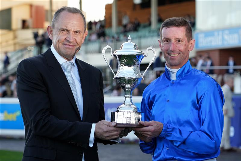 MELBOURNE, AUSTRALIA - AUGUST 29: Nash Rawiller poses with trainer Chris Waller after riding Beiwacht to win race 8, the Stow Storage Memsie Stakes during Melbourne Racing at Caulfield Racecourse on August 29, 2026 in Melbourne, Australia. (Photo by Vince Caligiuri/Getty Images)