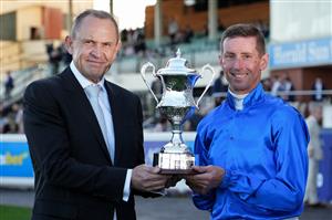 MELBOURNE, AUSTRALIA - AUGUST 29: Nash Rawiller poses with trainer Chris Waller after riding Beiwacht to win race 8, the Stow Storage Memsie Stakes during Melbourne Racing at Caulfield Racecourse on August 29, 2026 in Melbourne, Australia. (Photo by Vince Caligiuri/Getty Images)