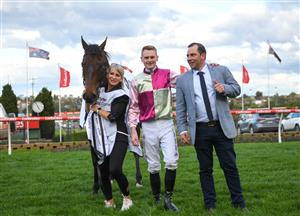 MELBOURNE, AUSTRALIA - SEPTEMBER 07: Ethan Brown poses with Trainer Gavin Bedggood and strapper Karen Flaherty after riding Mornington Glory to win in Race 9, the Charter Keck Cramer Moir Stakes - Betting Odds during Melbourne Racing at Moonee Valley Racecourse on September 07, 2024 in Melbourne, Australia. (Photo by Vince Caligiuri/Getty Images)