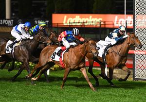 MELBOURNE, AUSTRALIA - SEPTEMBER 23: Jamie Kah riding Coolangatta defeats Craig Williams riding Bella Nipotina in Race 7, the Charter Keck Cramer Moir Stakes during Moir Stakes Night at Moonee Valley Racecourse on September 23, 2022 in Melbourne, Australia. (Photo by Vince Caligiuri/Getty Images)