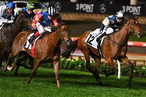 MELBOURNE, AUSTRALIA - SEPTEMBER 23: Jamie Kah riding Coolangatta defeats Craig Williams riding Bella Nipotina in Race 7, the Charter Keck Cramer Moir Stakes during Moir Stakes Night at Moonee Valley Racecourse on September 23, 2022 in Melbourne, Australia. (Photo by Vince Caligiuri/Getty Images)