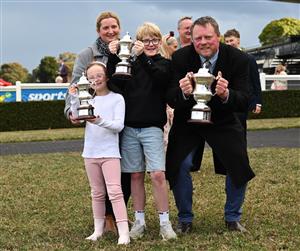MELBOURNE, AUSTRALIA - SEPTEMBER 05: Trainer John McArdle poses with family after My Gladiola wo race 8, the Charter Keck Cramer Moir Stakes during Melbourne Racing at Sandown Racecourse on September 05, 2026 in Melbourne, Australia. (Photo by Vince Caligiuri/Getty Images)