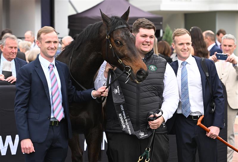 MELBOURNE, AUSTRALIA - SEPTEMBER 13: Strapper Will Evans poses with Co trainers JD Hayes and Will Hayes (r) after Mr Brightside won Race 8, the Crown Makybe Diva Stakes during Melbourne Racing at Flemington Racecourse on September 13, 2025 in Melbourne, Australia. (Photo by Vince Caligiuri/Getty Images)