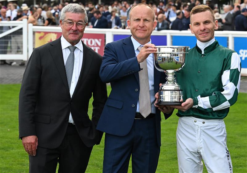 MELBOURNE, AUSTRALIA - SEPTEMBER 19: Ben Melham poses with trophy with Darren Beadman (L) and Danny Rolston of Yulong after Angel Capital won race 9, the Sportsbet Sir Rupert Clarke Stakes during Melbourne Racing at Caulfield Racecourse on September 19, 2026 in Melbourne, Australia. (Photo by Vince Caligiuri/Getty Images)