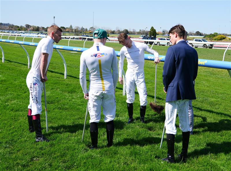 MELBOURNE, AUSTRALIA - SEPTEMBER 19: Mark Zahra and fellow jockeys are seen inspecting the track before Melbourne Racing at Caulfield Racecourse on September 19, 2026 in Melbourne, Australia. (Photo by Vince Caligiuri/Getty Images)