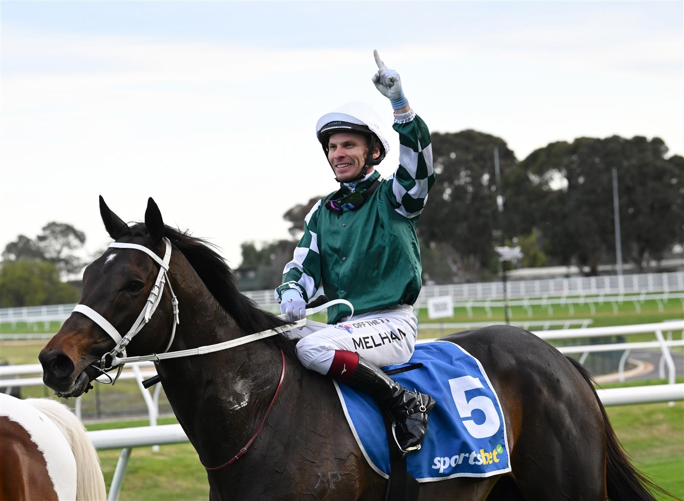 MELBOURNE, AUSTRALIA - SEPTEMBER 19: Ben Melham riding Angel Capital after winning race 9, the Sportsbet Sir Rupert Clarke Stakes during Melbourne Racing at Caulfield Racecourse on September 19, 2026 in Melbourne, Australia. (Photo by Vince Caligiuri/Getty Images)