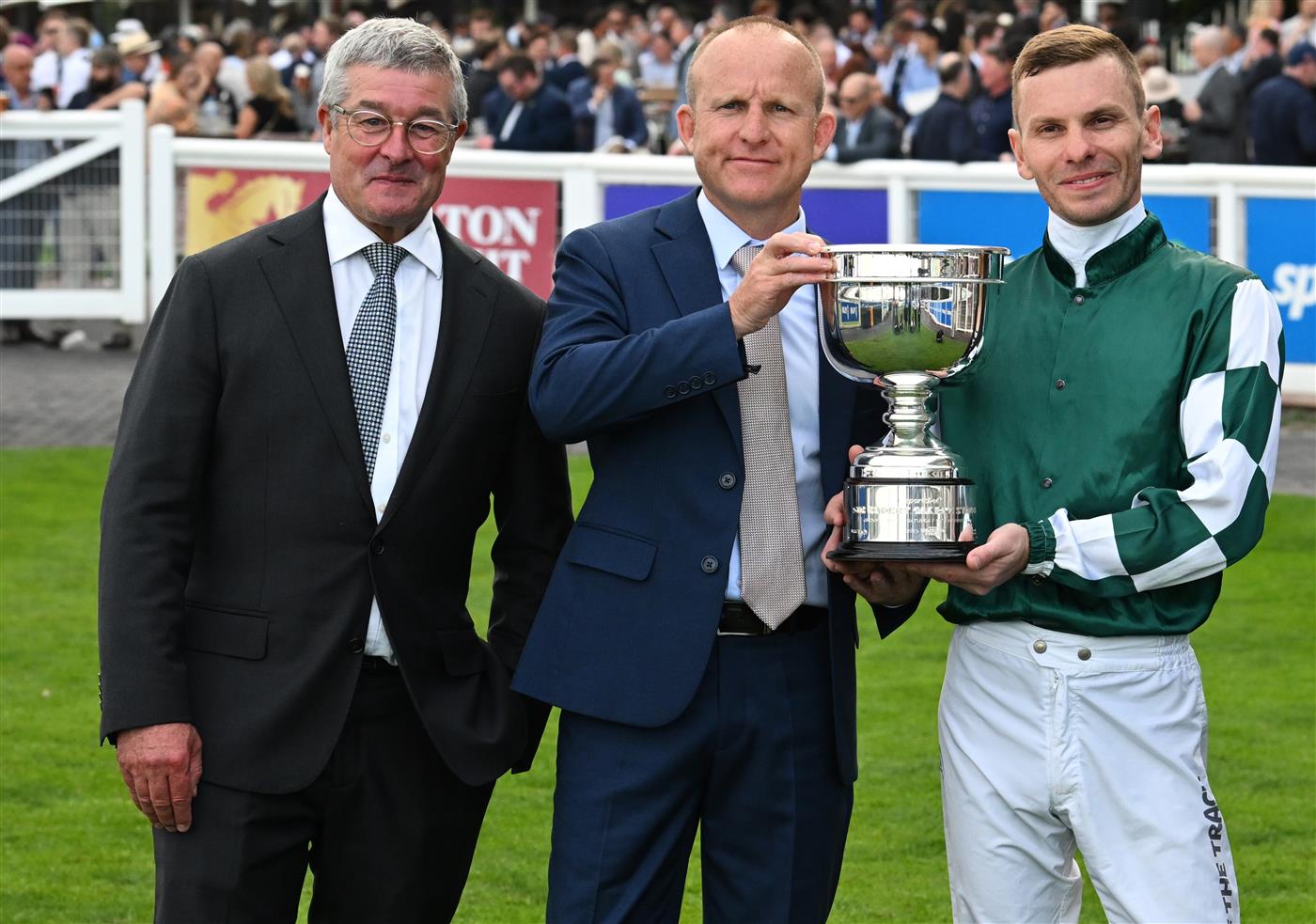 MELBOURNE, AUSTRALIA - SEPTEMBER 19: Ben Melham poses with trophy with Darren Beadman (L) and Danny Rolston of Yulong after Angel Capital won race 9, the Sportsbet Sir Rupert Clarke Stakes during Melbourne Racing at Caulfield Racecourse on September 19, 2026 in Melbourne, Australia. (Photo by Vince Caligiuri/Getty Images)