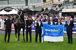 MELBOURNE, AUSTRALIA - SEPTEMBER 19: Darren Beadman holds the trophy alongside Danny Rolston of Yulong after Angel Capital won race 9, the Sportsbet Sir Rupert Clarke Stakes during Melbourne Racing at Caulfield Racecourse on September 19, 2026 in Melbourne, Australia. (Photo by Vince Caligiuri/Getty Images)