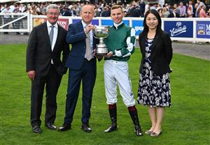 MELBOURNE, AUSTRALIA - SEPTEMBER 19: Ben Melham poses with trophy with Darren Beadman (L) and Danny Rolston of Yulong after Angel Capital won race 9, the Sportsbet Sir Rupert Clarke Stakes during Melbourne Racing at Caulfield Racecourse on September 19, 2026 in Melbourne, Australia. (Photo by Vince Caligiuri/Getty Images)