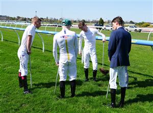 MELBOURNE, AUSTRALIA - SEPTEMBER 19: Mark Zahra and fellow jockeys are seen inspecting the track before Melbourne Racing at Caulfield Racecourse on September 19, 2026 in Melbourne, Australia. (Photo by Vince Caligiuri/Getty Images)