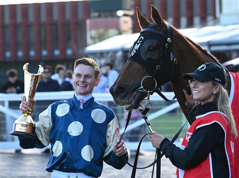 MELBOURNE, AUSTRALIA - SEPTEMBER 27: Ethan Brown  poses with trophy after riding Jimmysstar to win race 8, the Ladbrokes Manikato Stakes  during Melbourne Racing at Caulfield Racecourse on September 27, 2026 in Melbourne, Australia. (Photo by Vince Caligiuri/Getty Images)