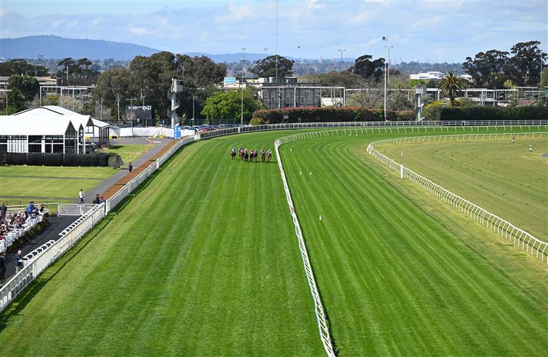 MELBOURNE, AUSTRALIA - SEPTEMBER 27: General view of Michael Dee riding Regal Ambition winning race 2, the Sportsbet Jim Moloney Stakes during Melbourne Racing at Caulfield Racecourse on September 27, 2026 in Melbourne, Australia. (Photo by Vince Caligiuri/Getty Images)