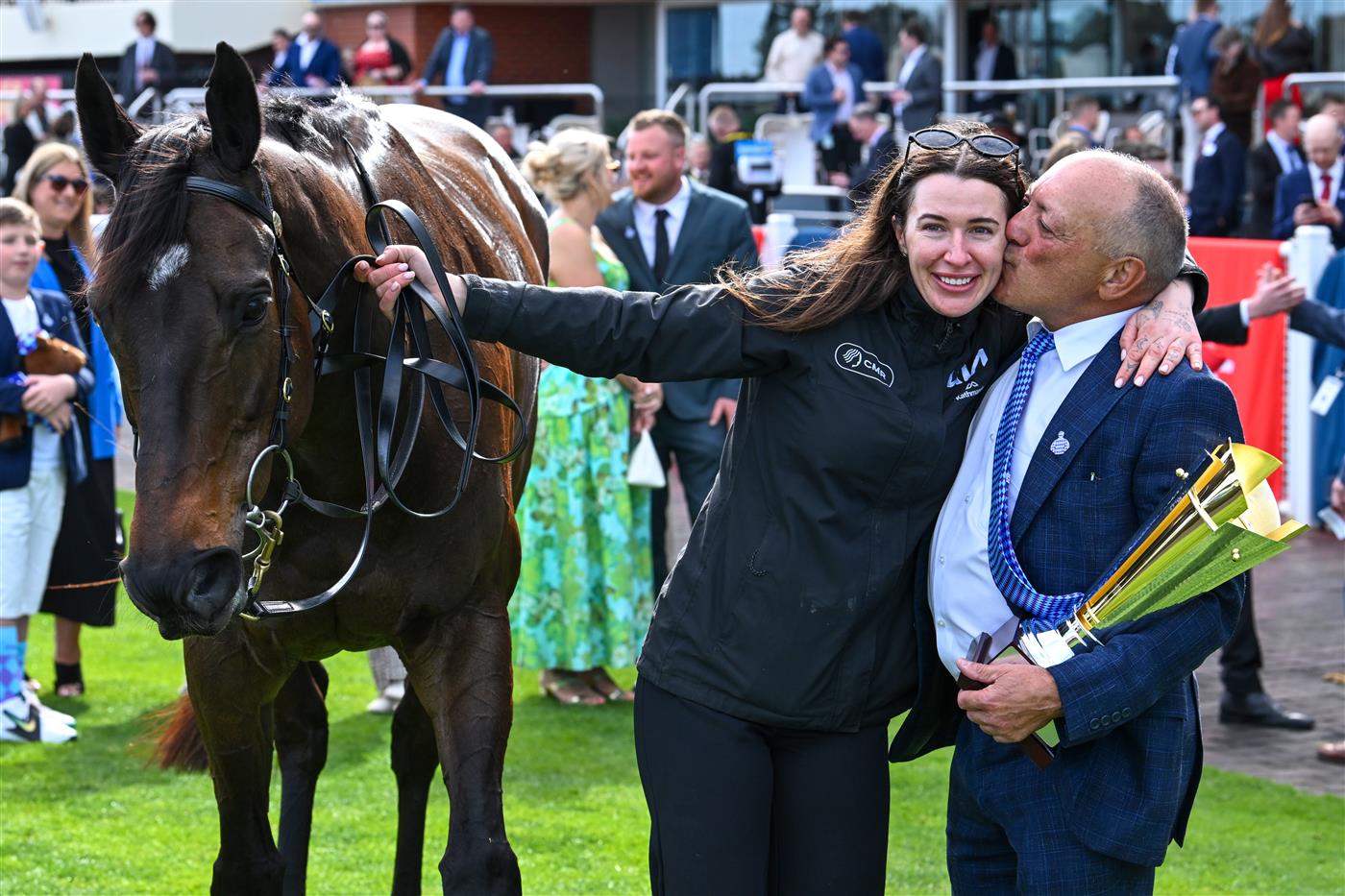 MELBOURNE, AUSTRALIA - SEPTEMBER 27: Tony Ottobre congratulates strapper Sammie Waters after Pride of Jenni won race 5, the Ladbrokes Feehan Stakes during Melbourne Racing at Caulfield Racecourse on September 27, 2026 in Melbourne, Australia. (Photo by Vince Caligiuri/Getty Images)