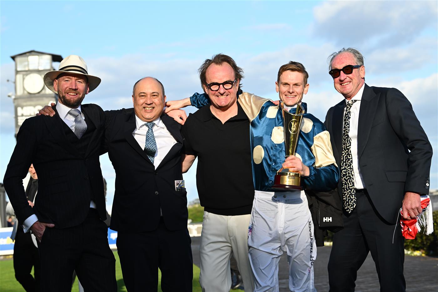 MELBOURNE, AUSTRALIA - SEPTEMBER 27: Ethan Brown poses with trainer Ciaron Maher and connections after riding Jimmysstar to win race 8, the Ladbrokes Manikato Stakes  during Melbourne Racing at Caulfield Racecourse on September 27, 2026 in Melbourne, Australia. (Photo by Vince Caligiuri/Getty Images)