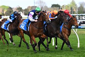 MELBOURNE, AUSTRALIA - SEPTEMBER 27: Mark Zahra riding Over The Bridge defeats I am Aria and Scintillation in race 4, the Dominant Scarborough Stakes during Melbourne Racing at Caulfield Racecourse on September 27, 2026 in Melbourne, Australia. (Photo by Vince Caligiuri/Getty Images)