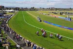 MELBOURNE, AUSTRALIA - SEPTEMBER 27: General view of Michael Dee riding Regal Ambition winning race 2, the Sportsbet Jim Moloney Stakes with the rail out thirteen metres during Melbourne Racing at Caulfield Racecourse on September 27, 2026 in Melbourne, Australia. (Photo by Vince Caligiuri/Getty Images)