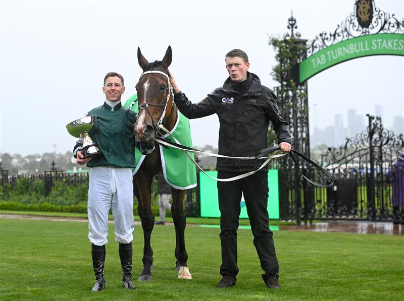 MELBOURNE, AUSTRALIA - OCTOBER 05: Damian Lane poses with the trophy after riding Via Sistina to win Race 8, theTab Turnbull Stakes - Betting Odds during Melbourne Racing at Flemington Racecourse on October 05, 2024 in Melbourne, Australia. (Photo by Vince Caligiuri/Getty Images)