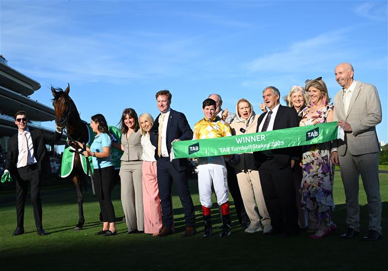 MELBOURNE, AUSTRALIA - OCTOBER 04: Craig Williams poses with Trainer Gai Waterhouse and connections after riding Sir Delius dismounts after winning Race 8, the Tab Turnbull Stakes  during Melbourne Racing at Flemington Racecourse on October 04, 2025 in Melbourne, Australia. (Photo by Vince Caligiuri/Getty Images)