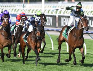 MELBOURNE, AUSTRALIA - OCTOBER 02: Brett Prebble riding Incentivise defeats Daniel Moor riding Young Werther in Race 7, the Tab Turnbull Stakes, during Melbourne Racing at Flemington Racecourse on October 02, 2021 in Melbourne, Australia. (Photo by Vince Caligiuri/Getty Images)