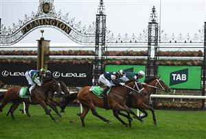 MELBOURNE, AUSTRALIA - OCTOBER 05: Damian Lane riding Via Sistina defeats Joao Moreira riding Buckaroo in Race 8, theTab Turnbull Stakes - Betting Odds during Melbourne Racing at Flemington Racecourse on October 05, 2024 in Melbourne, Australia. (Photo by Vince Caligiuri/Getty Images)