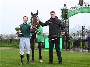 MELBOURNE, AUSTRALIA - OCTOBER 05: Damian Lane poses with the trophy after riding Via Sistina to win Race 8, theTab Turnbull Stakes - Betting Odds during Melbourne Racing at Flemington Racecourse on October 05, 2024 in Melbourne, Australia. (Photo by Vince Caligiuri/Getty Images)