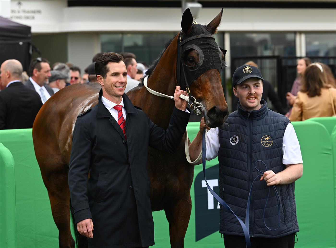 MELBOURNE, AUSTRALIA - OCTOBER 03: Trainer Michael Kent Jnr poses with Miss Waititi after winning race 3, the Howden Super Impose Stakes during Turnbull Stakes Day at Flemington Racecourse on October 03, 2026 in Melbourne, Australia. (Photo by Vince Caligiuri/Getty Images)