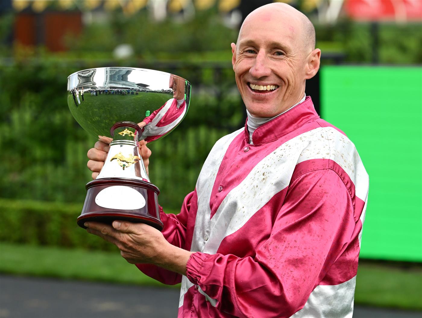 MELBOURNE, AUSTRALIA - OCTOBER 03: William Pike poses with trophy after riding Cosmic Crusader to win race 8, the Tab Turnbull Stakes  during Turnbull Stakes Day at Flemington Racecourse on October 03, 2026 in Melbourne, Australia. (Photo by Vince Caligiuri/Getty Images)